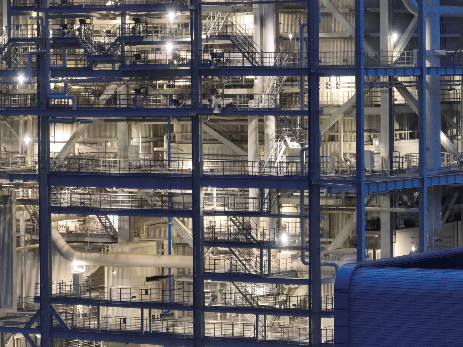 The boiler structure illuminated at dusk